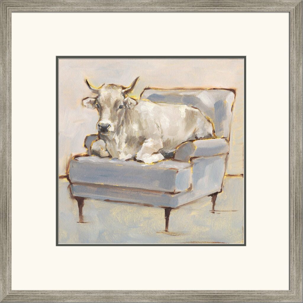 Framed painting of a light-colored cow lounging on a blue armchair, pastel tones and soft brushstrokes suggest a cozy, rustic scene.